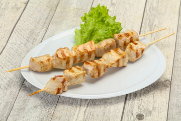 Grilled pork skewer served salad