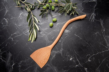 hand carved wooden kitchen tools on the table