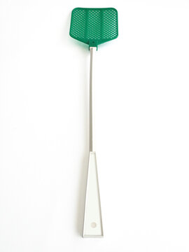 Single green extendable flyswatter isolated on white background. Telescopic fly swatter. Object made of plastic, very efficient and unfailing tool in catching flies. VERTICAL orientation.