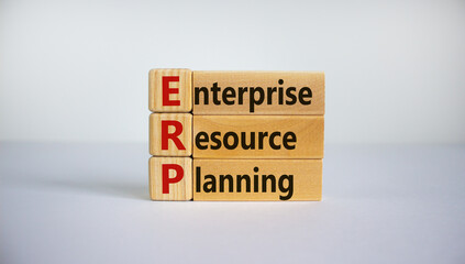 Naklejka premium Concept words 'ERP, enterprise resourse planning' on cubes on a beautiful white background. Business concept. Copy space.