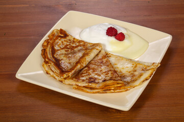 Pancakes with sour cream and condenced milk