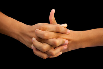 Shot of a human hand showing Linga mudra with interlocked fingers and thumb coming out of it...