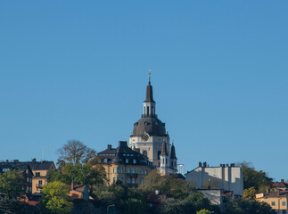 Fototapeta na wymiar Skyline over the district Maria and the church Maria kyrkan and old houses in Stockholm an autumn day