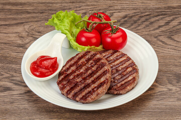 Grilled burger cutlet with sauce