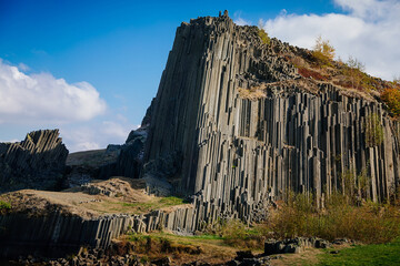 Rock formation natural monument Basalt organ. Polygonal structures of basalt columnar separation in...