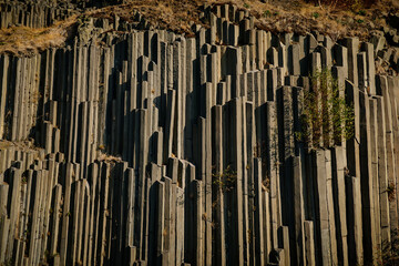 Rock formation natural monument Basalt organ. Polygonal structures of basalt columnar separation in Panska skala near Kamenicky Senov, northern Bohemia, Czech Republic