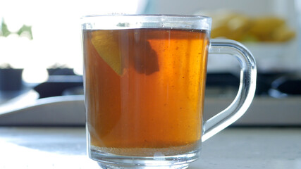 Image with a Hot and Aromatic Tea in a Transparent Cup