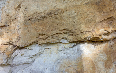 Natural mountain stone,a section of rock texture on a Sunny day.