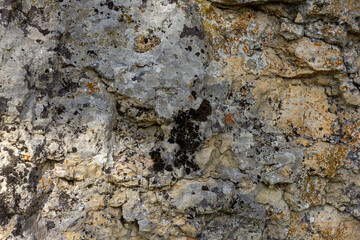 Natural mountain stone,a section of rock texture on a Sunny day.