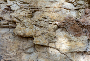 Natural mountain stone,a section of rock texture on a Sunny day.
