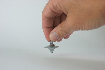 Steel metal spinner and male hand Inception