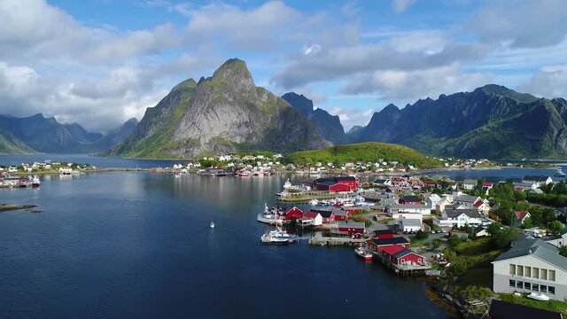 view of a beautiful town with a bay whis boats in the fjords