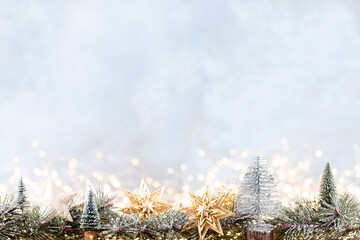 Christmas ornament with string lights on blue background.