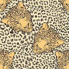 Leopard fur texture and leopard faces. Seamless pattern. Hand-drawn vector illustration. Animal art background.