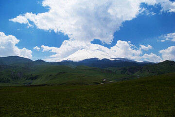 Mountain view. Mountains of the North Caucasus in summer. View of mount Elbrus. Eternal glacier.