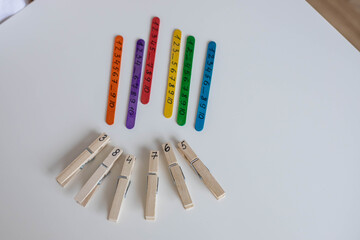 Using craft sticks for learning maths, numbers in early childhood. Home education, addition fun...