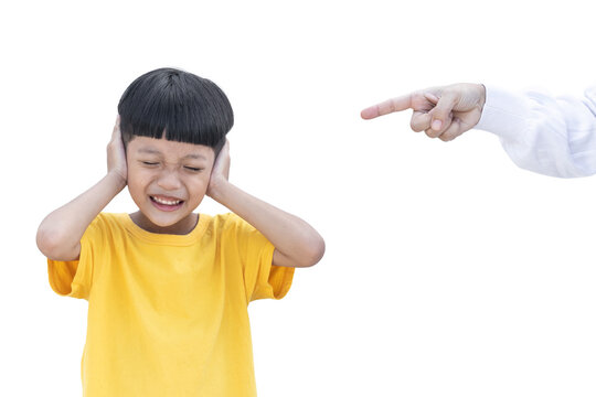 Asian Little Child Covered His Ear Isolated On White Background. Mother Was Pointing Finger At Her Son. Domestic Family Violence Concept. Sad And Unhappy Child.