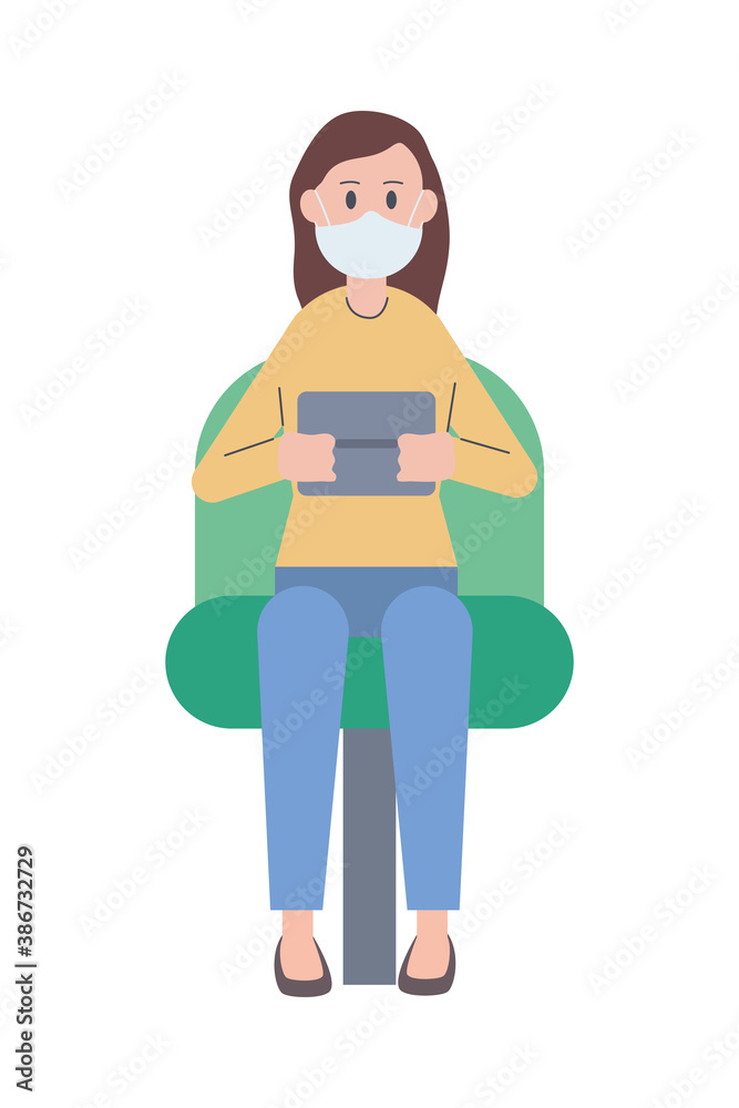 Wall mural woman wearing medical mask using tablet seated in chair