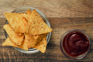 Corn cheese, snacks with sauce on a wooden stand. Beer snack, dish on the menu. Close up.
