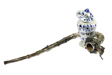 vintage apothecary jar and opium pipe isolated on white background