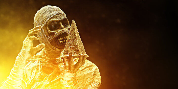 revived mummia with golden pyramide