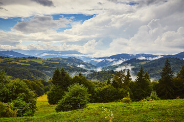 View from the Synevyr pass to the foggy mountains in National Natural Park Synevir, Mizhhirya district of the Transcarpathian region, Ukraine