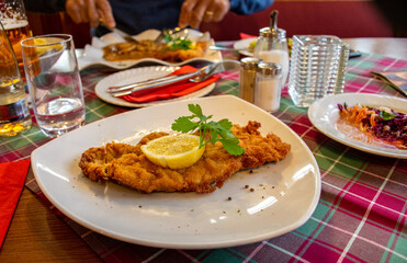 
'Wiener schnitzel' a typical national dish of breaded veal from the austrian cuisine
