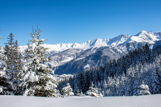 
View in winter of snowy mountain range in Serfaus-Fiss-Ladis, Tyrol, Austria with blue sky
