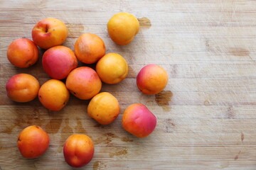 ripe apricots on a wooden table