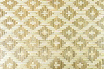 Close-up of bamboo wicker mat, handcraft weave, natural texture.