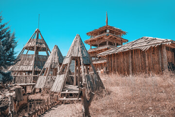 High wooden watchtower and teepees as decoration © EdNurg