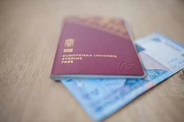 European Union, Sweden Passport with a Fifty Thousand Rupees Bill Iinside