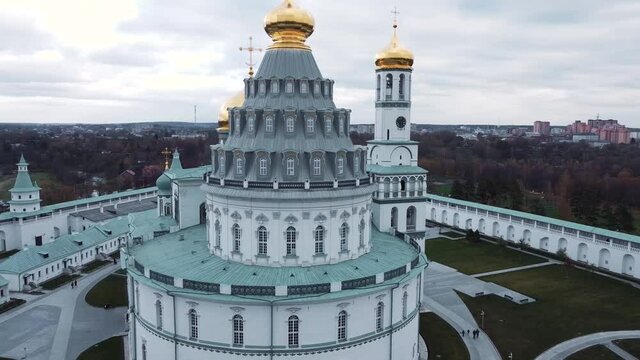 drone shooting, flying near the chapel and the copals of the monastery, clock tower and bell