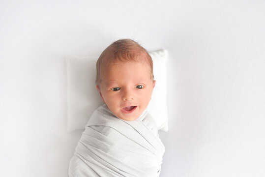 the newborn yawns,. Portrait of a newborn baby  . High quality photo
