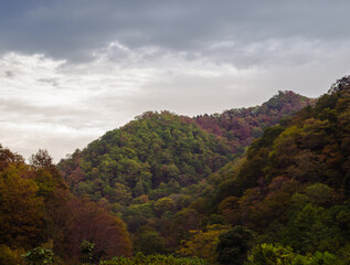 Cloudy weather in autumn mountains