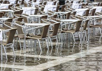 tables and chairs on the flooded San Marco 
