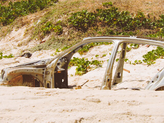 half car in the beach