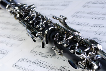 Close up of Boehm clarinet keywork on a sheet of music