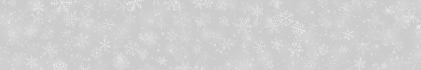 Fototapeta na wymiar Christmas banner of snowflakes of different shapes, sizes and transparency on gray background