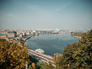 Kyiv, Ukraine - October 10th 2020: Cityscape of Podol district in Kyiv city. Kontraktova square, Kiev Mohyla Academy and Ferris wheel