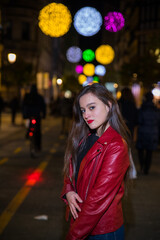 Girl going for a walk through Donostia-San Sebastian with the illuminations for Christmas.