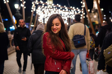 Girl going for a walk through Donostia-San Sebastian with the illuminations for Christmas.