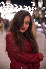 Girl going for a walk through Donostia-San Sebastian with the illuminations for Christmas.