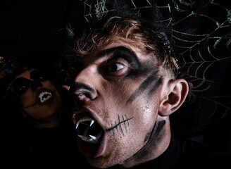 Fashion Glamour Halloween. Halloween sale and shopping. Portrait of happy young couple