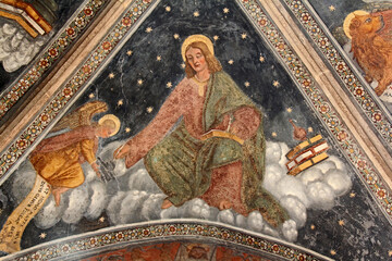 Fototapeta na wymiar l'Evangelista Matteo; volta del protiro della chiesa della Natività di Maria a Pellizzano (Trentino)
