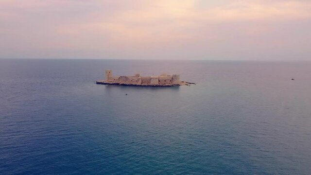 Aerial footage shows Maiden Castle or Deniz kalesi or Kizkalesi. Mersin Province, Turkey. High quality FullHD footage