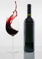 red wine pouring into glass