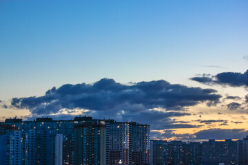 Beautiful sunset and clouds in the sunset orange and blue sky, big city view