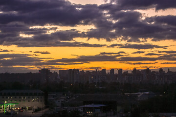 Beautiful sunset and clouds in the sunset orange and blue sky, big city view