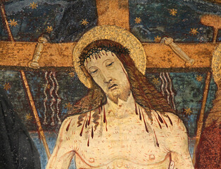 Naklejka premium Cristo morto e strumenti della Passione; lunetta del portale della chiesa della Natività di Maria a Pellizzano (Trentino)